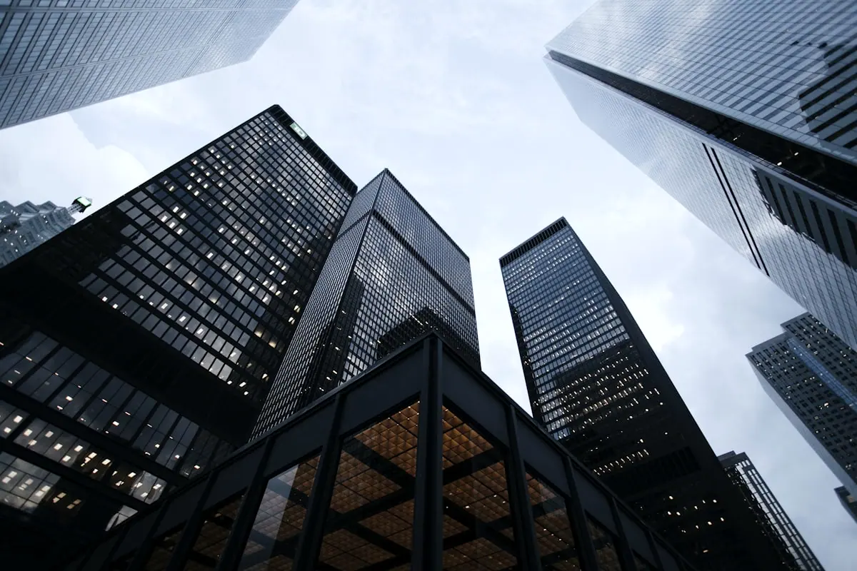 Mixed-use towers viewed from street level with strong vertical geometry